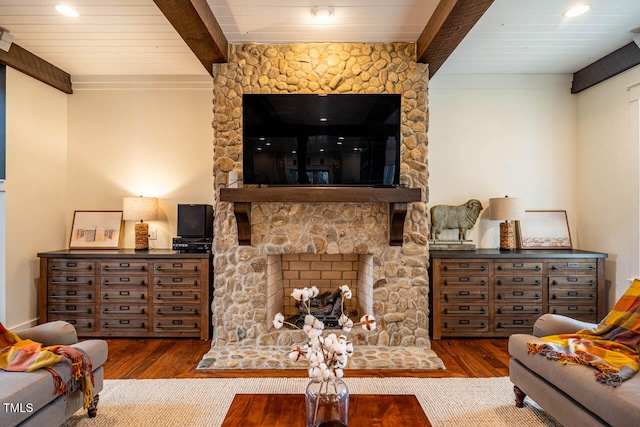 living room featuring beamed ceiling, wood ceiling, and hardwood / wood-style flooring