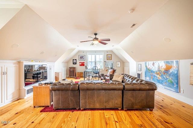 living room featuring vaulted ceiling, ceiling fan, and light hardwood / wood-style floors