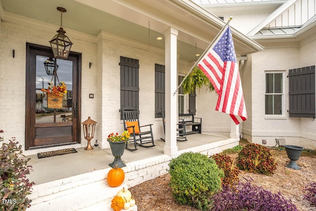 view of exterior entry featuring a porch