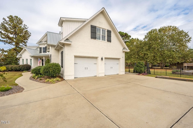 view of side of home with a garage