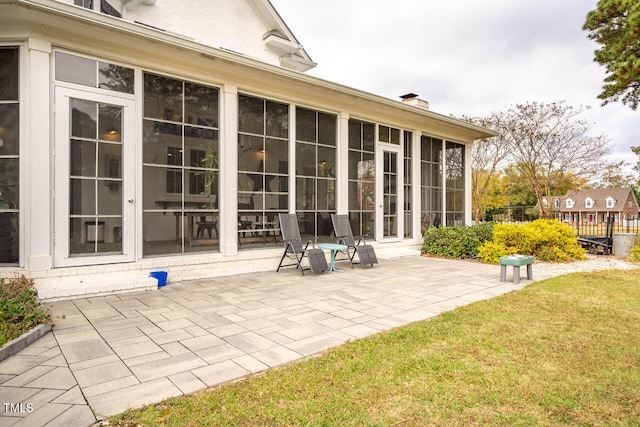 exterior space featuring a sunroom