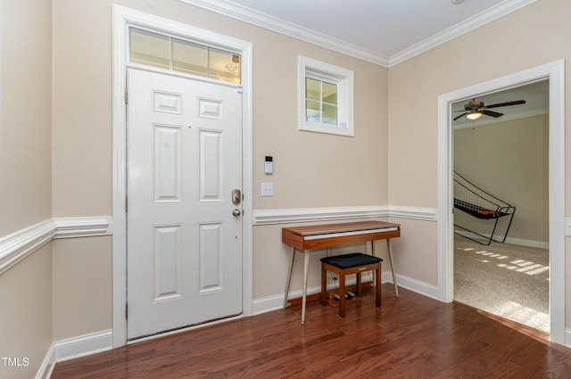 foyer featuring ornamental molding, dark hardwood / wood-style floors, and ceiling fan