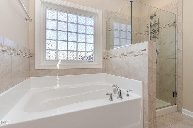 bathroom featuring tile patterned floors and shower with separate bathtub