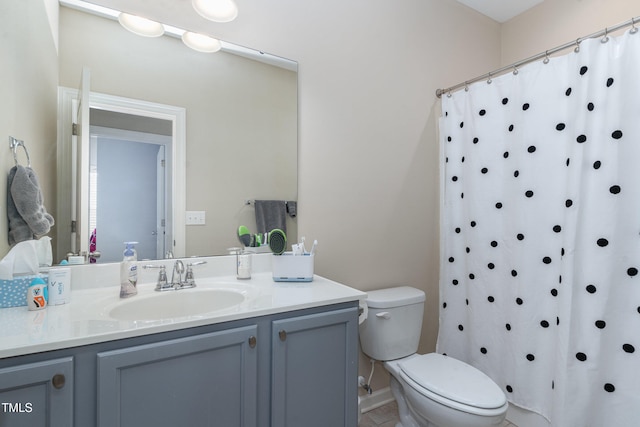 bathroom with vanity, a shower with curtain, toilet, and tile patterned flooring