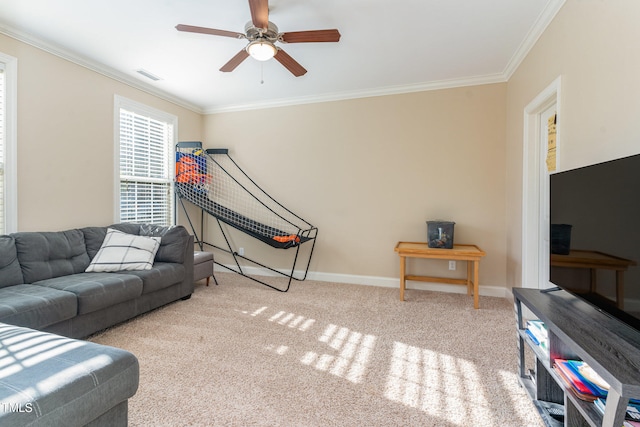 living room with light carpet, ornamental molding, and ceiling fan