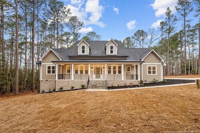 view of front of home featuring a front yard and a porch