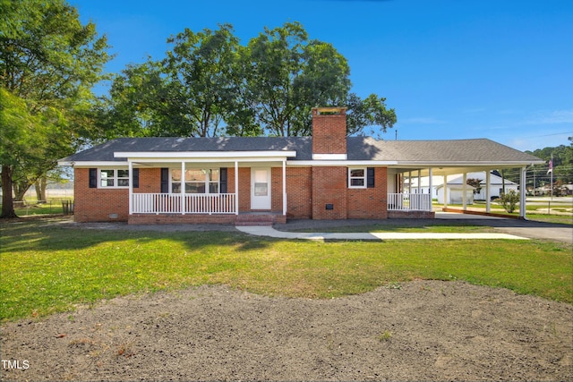 rear view of house with a yard and covered porch