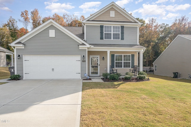 view of front facade featuring a front lawn, covered porch, and a garage