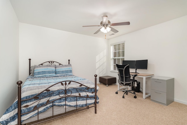 bedroom featuring light colored carpet and ceiling fan