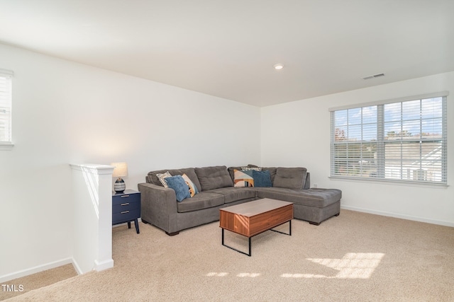 living room featuring light carpet