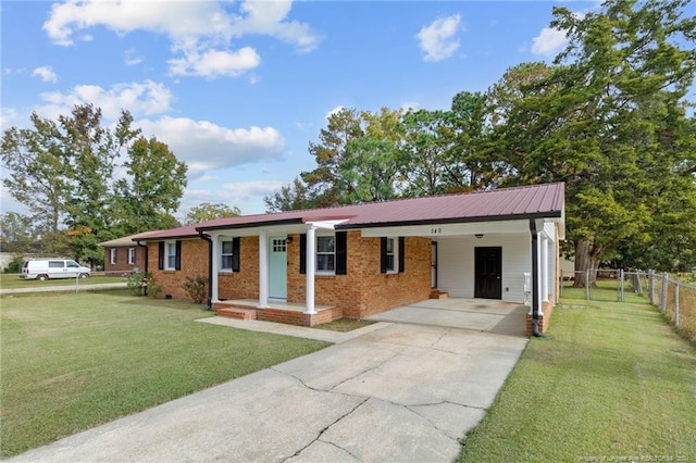 ranch-style home with a front yard and a carport