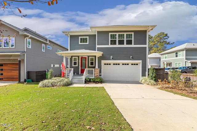 view of front of house featuring a garage, a porch, and a front lawn