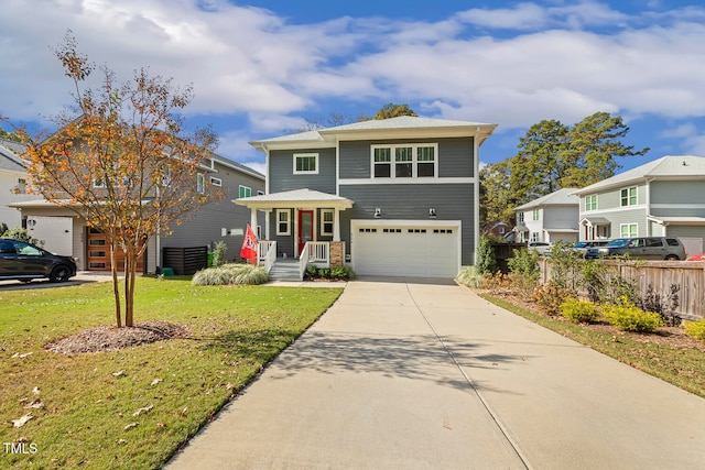 front of property featuring a front lawn and a garage