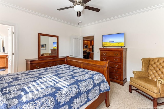 carpeted bedroom with ornamental molding, ensuite bathroom, and ceiling fan