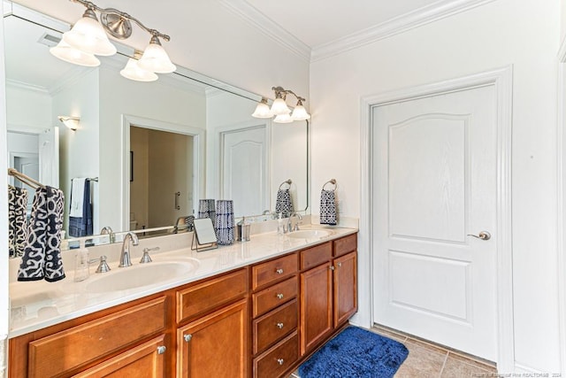 bathroom with vanity, crown molding, and tile patterned floors