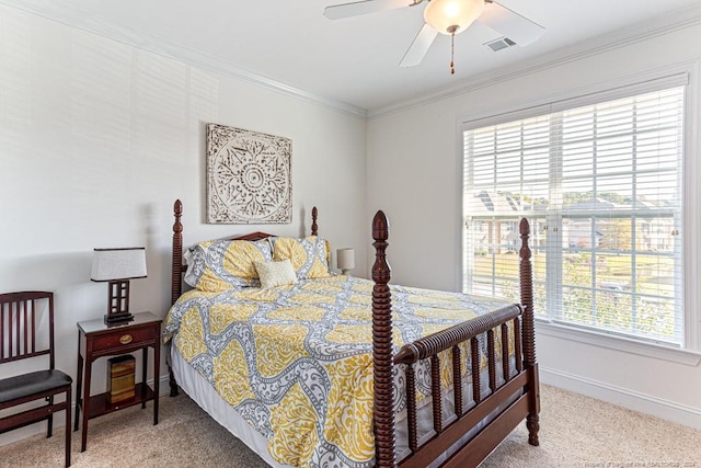 bedroom with ceiling fan, crown molding, and carpet flooring