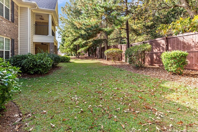 view of yard featuring a balcony