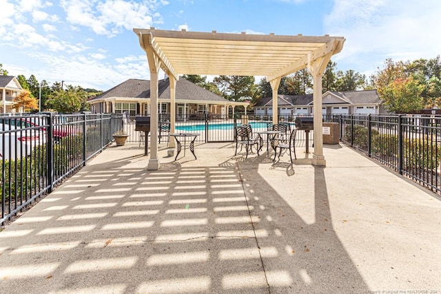 view of patio / terrace featuring a pergola and a community pool