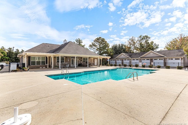 view of swimming pool featuring a patio