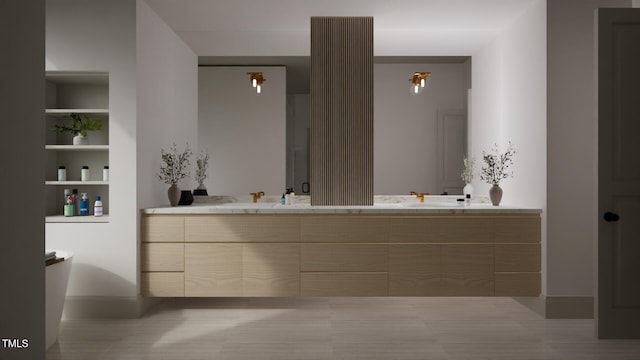 211 Reynolds Rd, Raleigh, NC 27609 - bathroom featuring double vanity, baseboards, and built in shelves