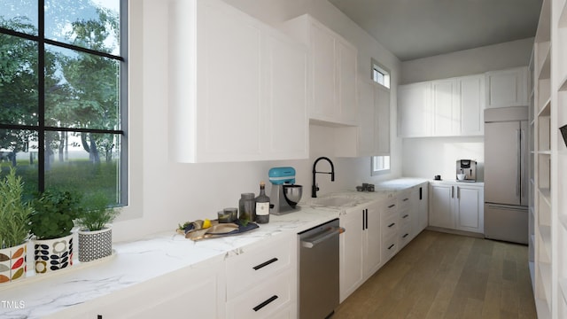 211 Reynolds Rd, Raleigh, NC 27609 - kitchen featuring a sink, dishwasher, built in fridge, white cabinetry, and light stone counters