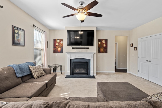 living room featuring light carpet and ceiling fan