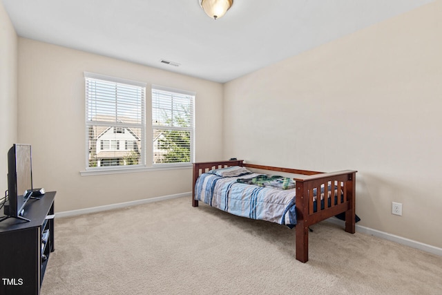 bedroom with light colored carpet