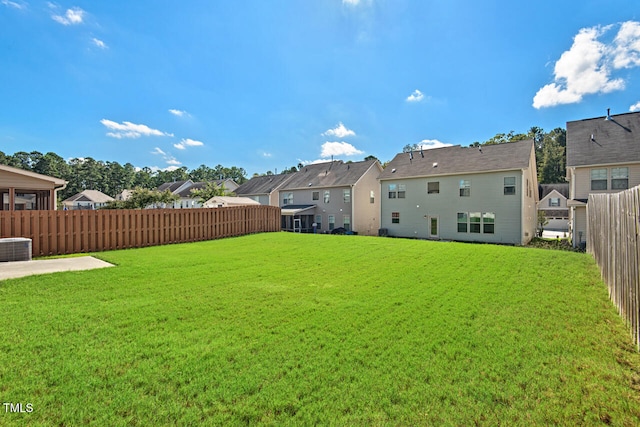 view of yard featuring central air condition unit