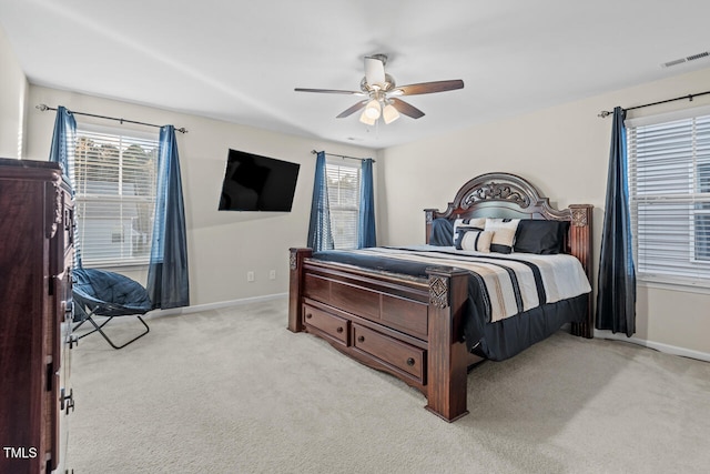 bedroom with light carpet and ceiling fan