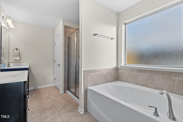 bathroom featuring tile patterned flooring, vanity, and independent shower and bath