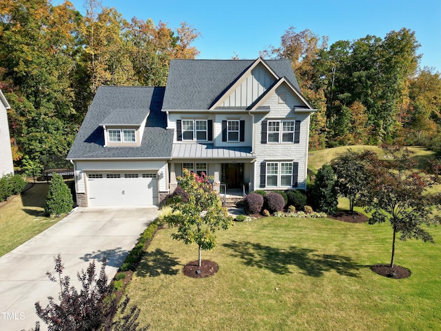 craftsman house featuring covered porch, a front lawn, and a garage