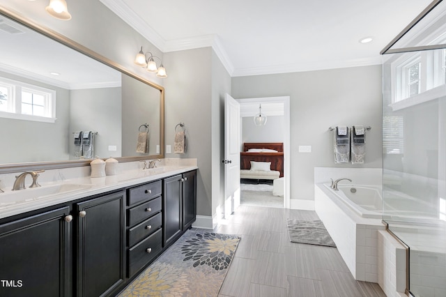 ensuite bathroom with crown molding, double vanity, a sink, and ensuite bath