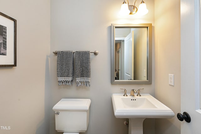 bathroom with toilet and a sink