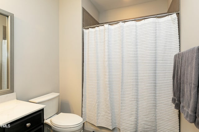 bathroom with vanity, a shower with curtain, and toilet