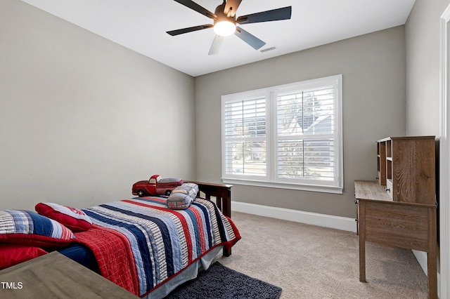 bedroom with visible vents, carpet flooring, baseboards, and ceiling fan