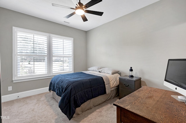 bedroom with baseboards, multiple windows, carpet flooring, and visible vents