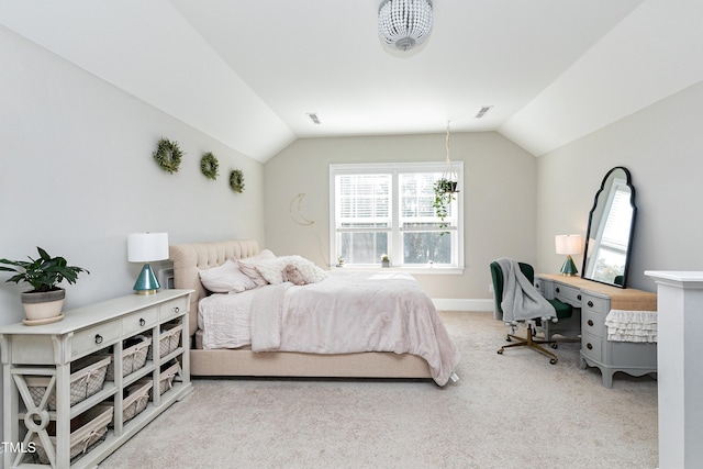 bedroom with carpet floors, baseboards, and lofted ceiling