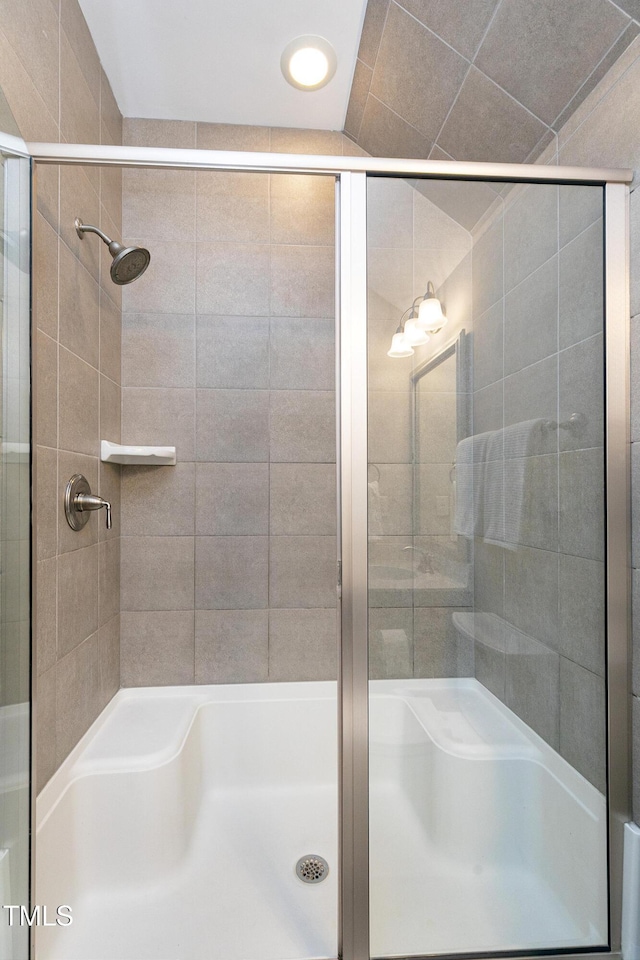 bathroom with vaulted ceiling and separate shower and tub