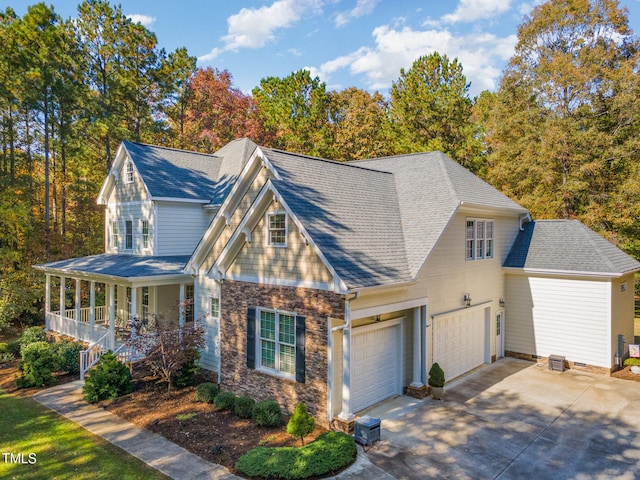 view of front of house with covered porch and a garage