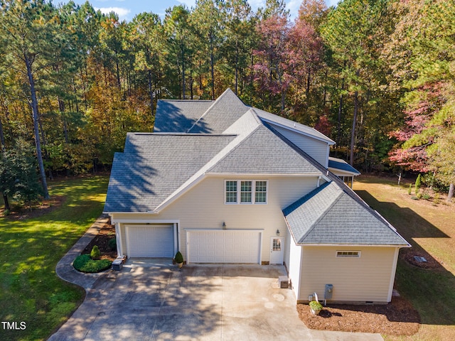 exterior space with a front yard and a garage