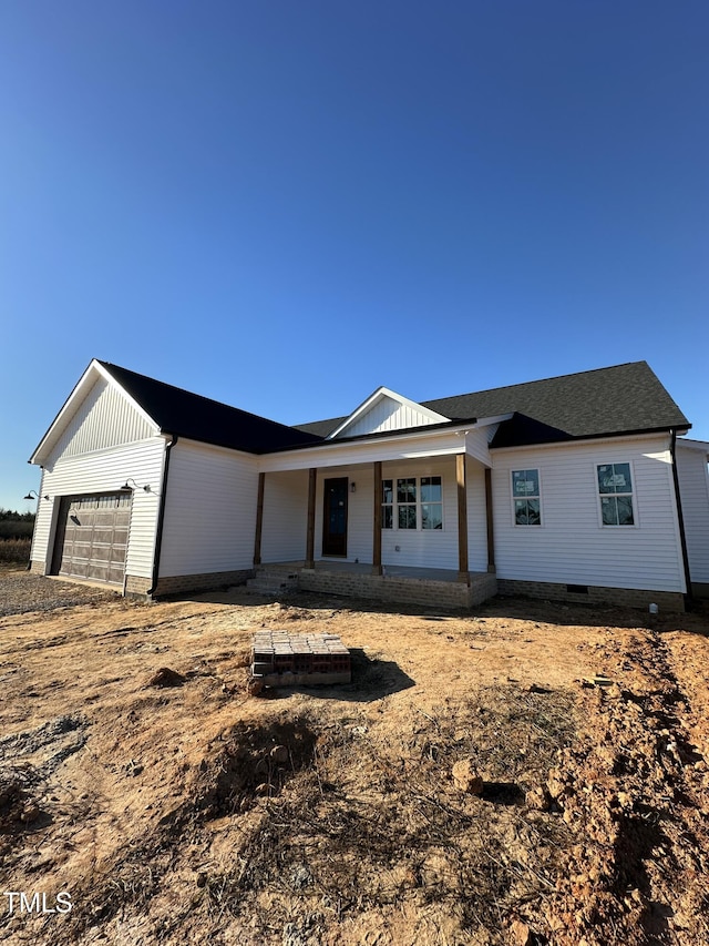 view of front of house featuring covered porch and crawl space