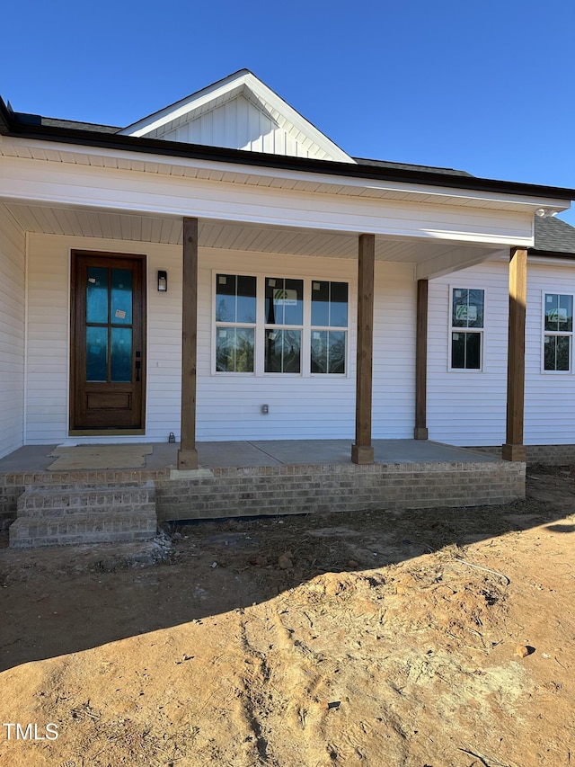 view of front of home with covered porch and board and batten siding