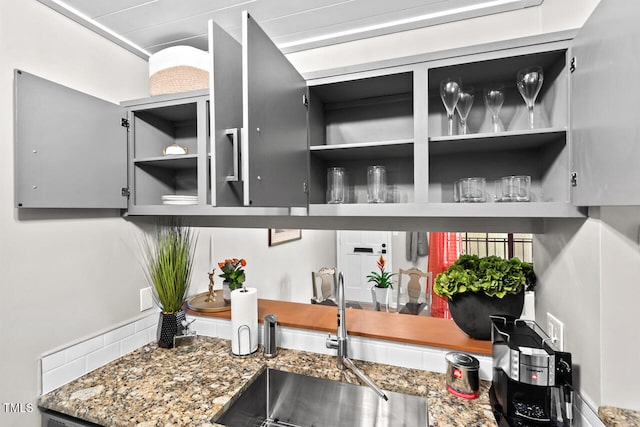 interior details with sink and dark stone counters