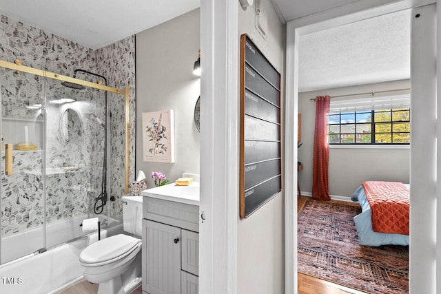 full bathroom featuring toilet, wood-type flooring, enclosed tub / shower combo, and vanity