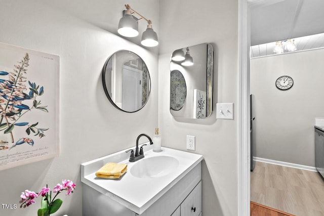 bathroom featuring vanity and wood-type flooring