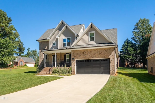 407 Eagle Ct, Henderson, NC 27536 - view of front facade with a front lawn, a porch, concrete driveway, brick siding, and a shingled roof