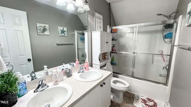 full bathroom featuring lofted ceiling, shower / bath combination with glass door, toilet, vanity, and tile patterned flooring