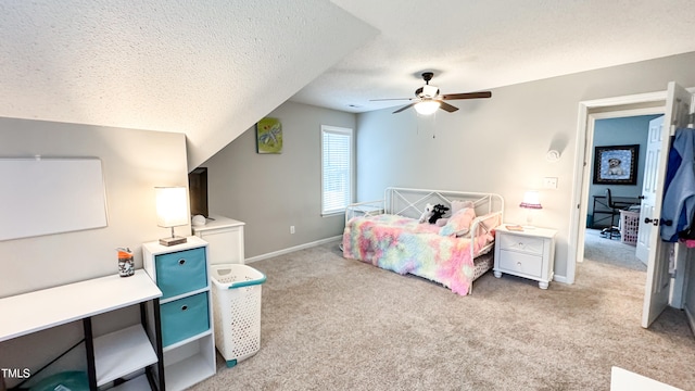 carpeted bedroom featuring ceiling fan, a textured ceiling, and lofted ceiling