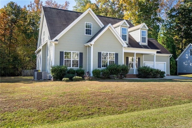 cape cod house with cooling unit, a front lawn, a porch, and a garage