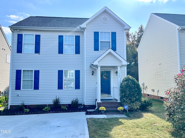 view of front of home featuring a front yard